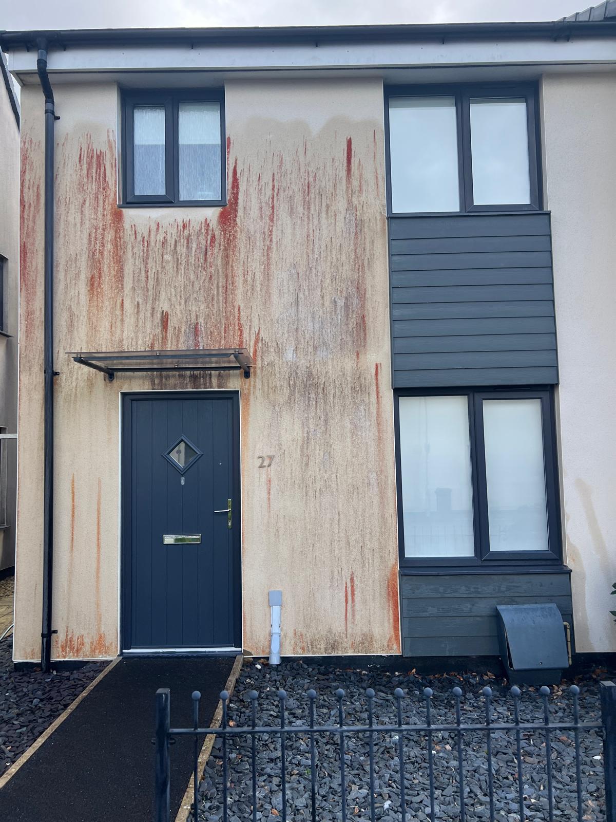 Before: House 27 front — red algae staining removed