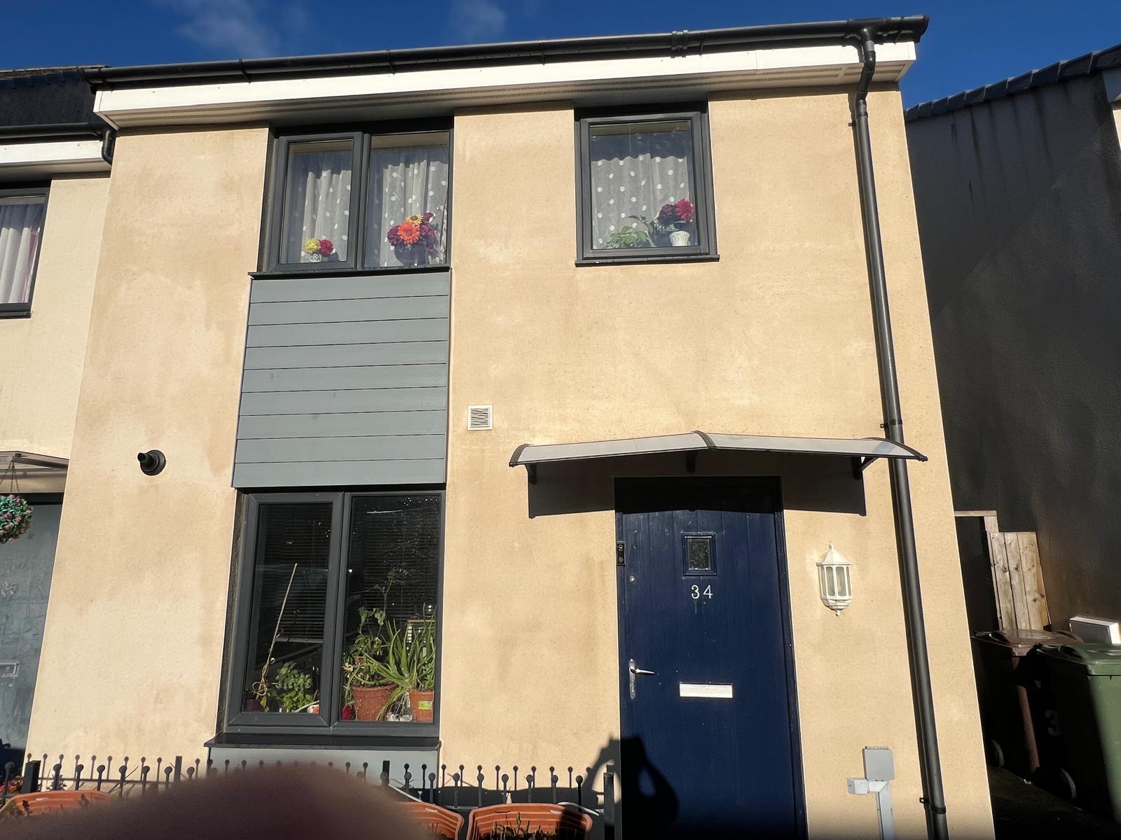 After: House front render — red algae removed