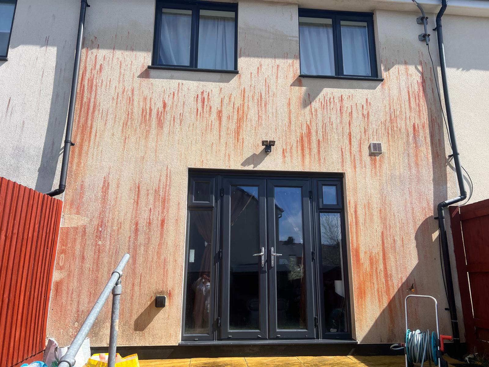 Before: Render back wall — orange staining lifted